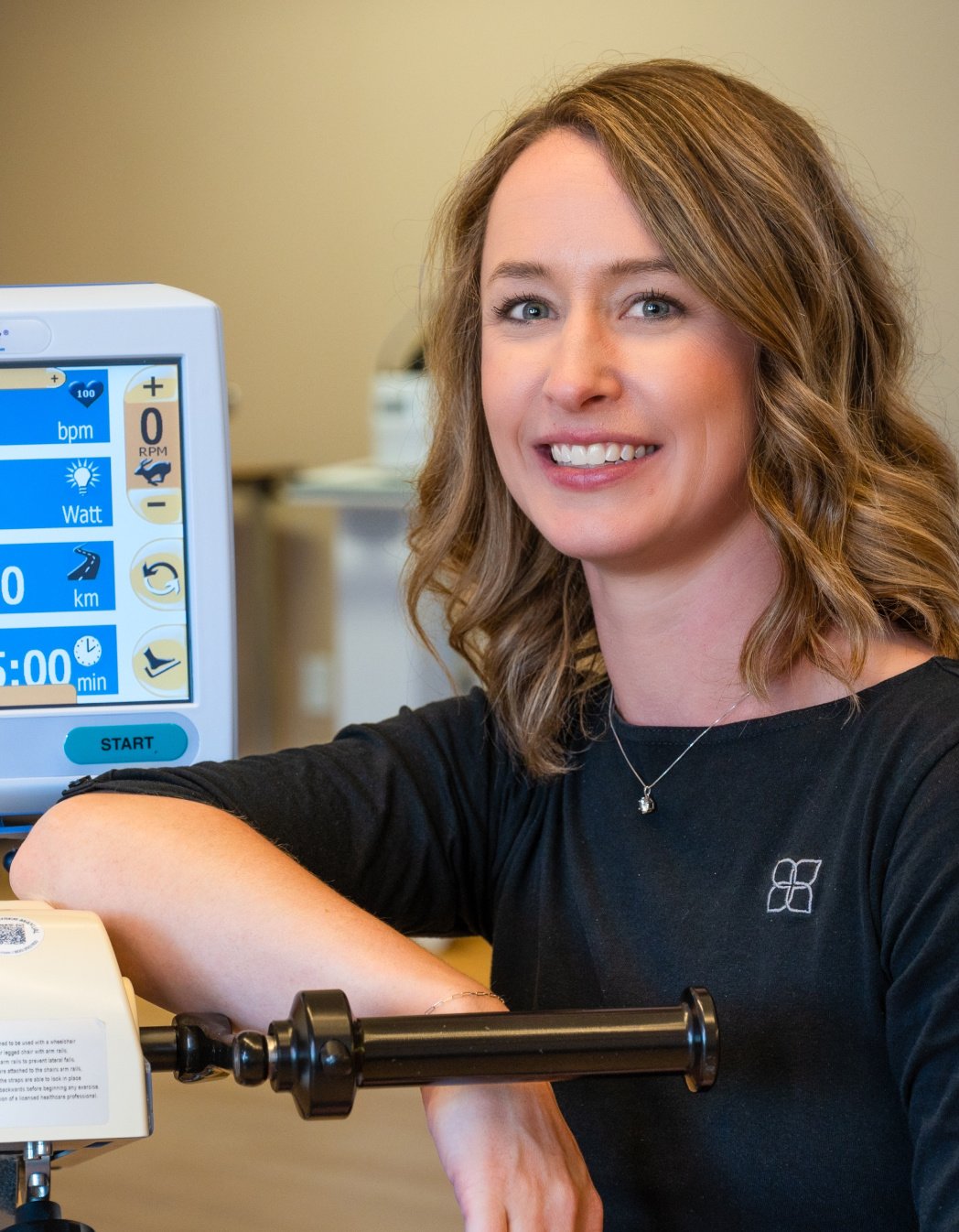 Physical Therapist headshot in therapy gym
